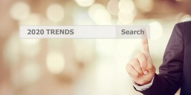 BusiBusinesman hand touching 2020 trends search bar with 2020 seo trendsnesman hand touching 2020 trends search bar over blur